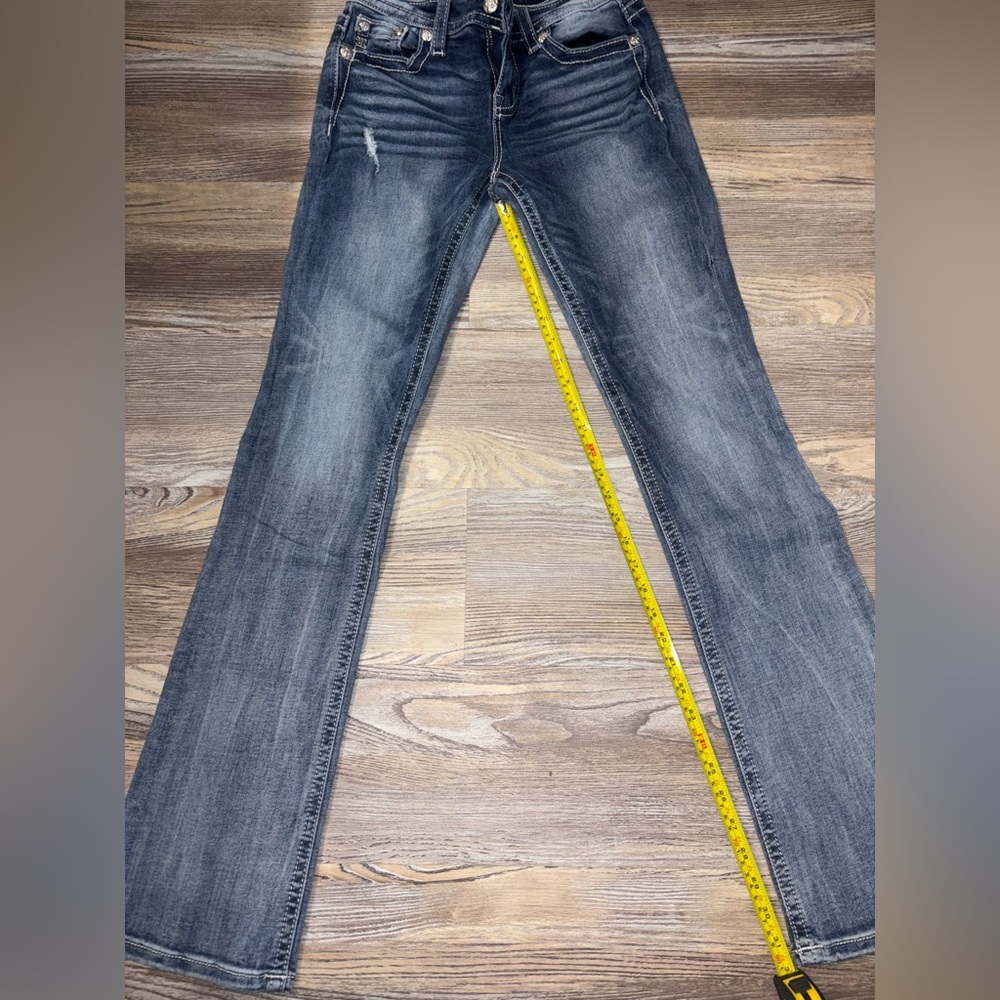 Women’s miss me jeans with feathers embroidered on the back pockets